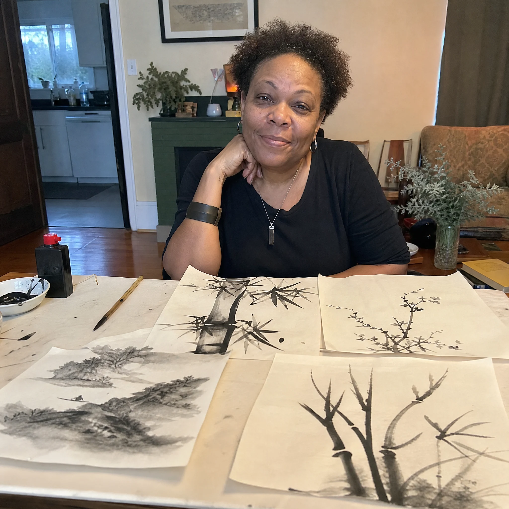 Claudia F. holding her finished floating-ink print