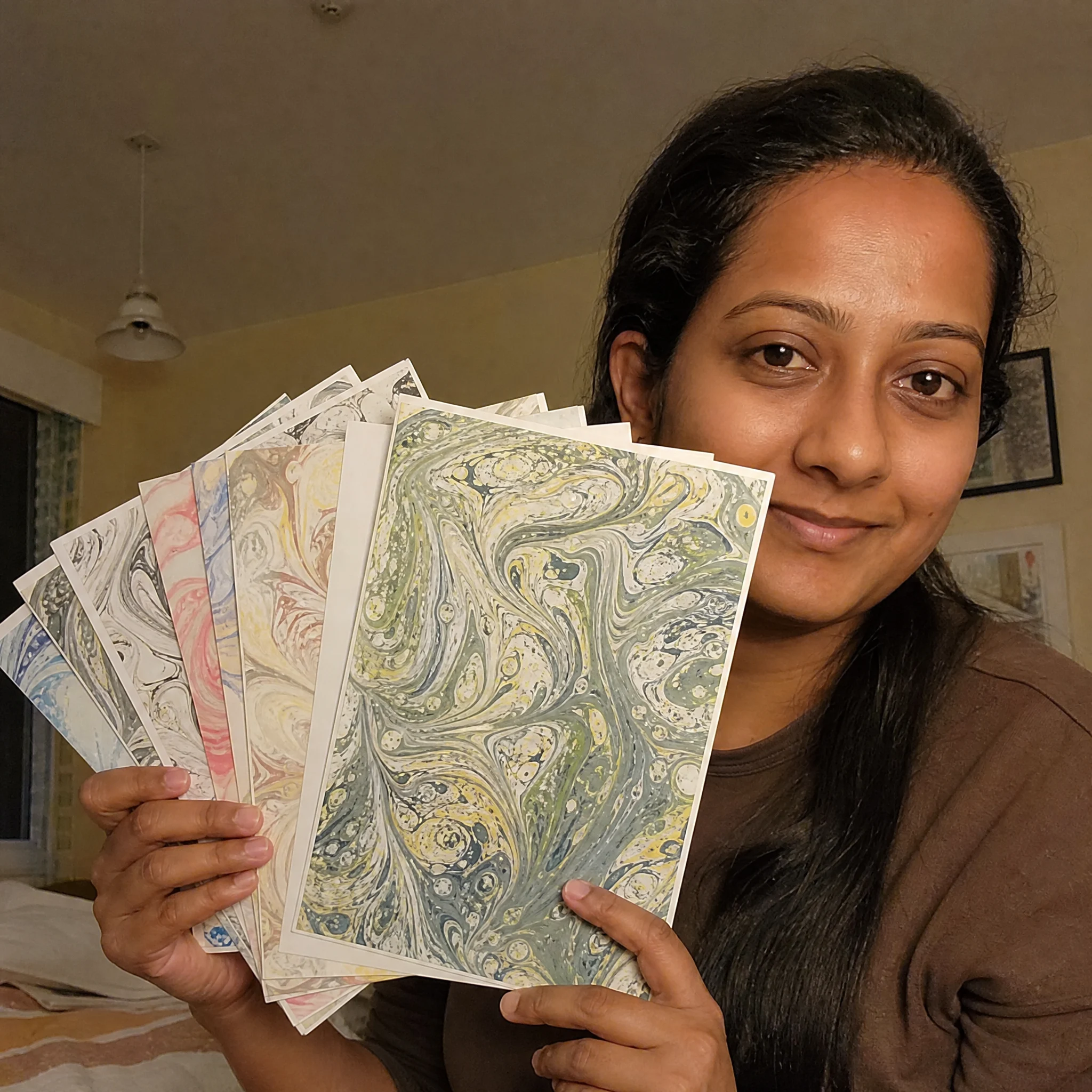 Yvonne B. holding her finished Japanese art